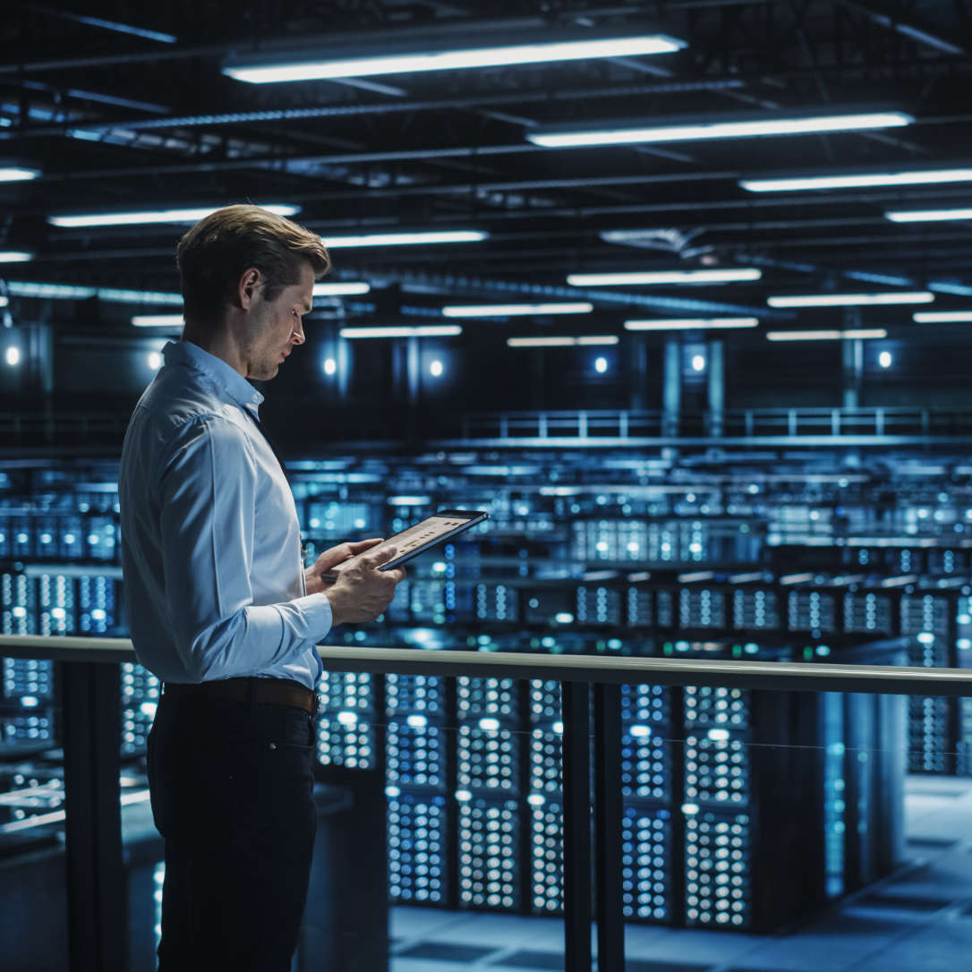 Data Center Engineer Using Digital Tablet